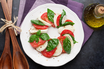 Caprese salad. Mozzarella, tomatoes and basil