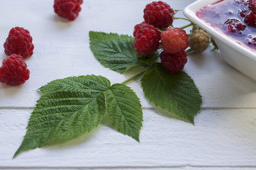 Green leaves and raspberries