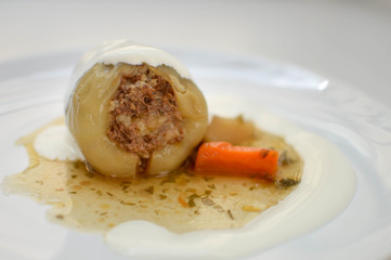 Stuffed peppers - traditional dish for some of the countries in Eastern Europe and Central Asia. Sweet paper stuffed with minced meet, rice and herbs, served with gravy and sour cream