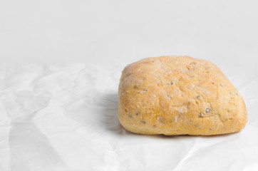 Fototapeta na wymiar Fresh white bread on a parchment