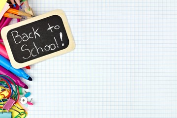 Back to School chalkboard tag with school supplies side border on graphing paper background