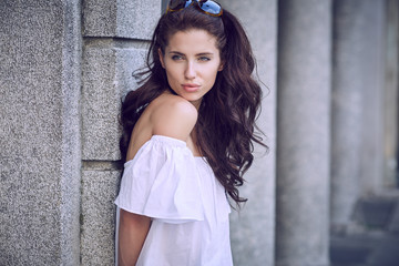 Portrait close up of young beautiful haired woman, on summer sce