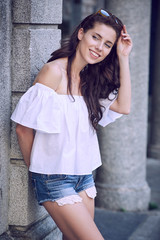 Portrait close up of young beautiful haired woman, on summer sce