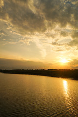 Fototapeta na wymiar reflection on the river in sunset background.