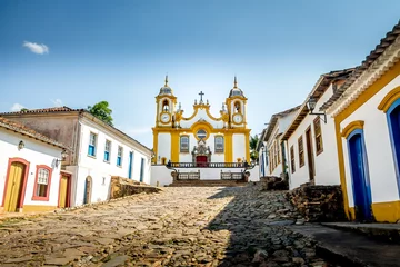 Fotobehang Colorful colonial houses and church in city of Tiradentes - Minas Gerais, Brazil © diegograndi