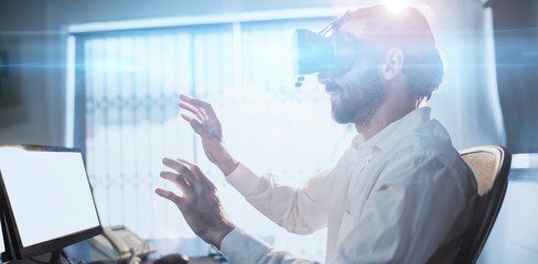 Businessman wearing virtual glasses