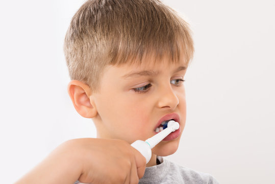 Close-up Of Boy Brushing Teeth