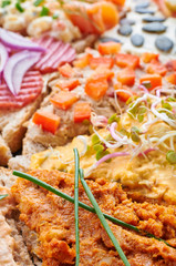 Mix of sandwiches on a stone board