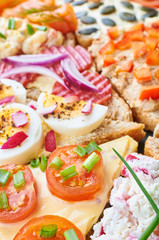 Mix of sandwiches on a stone board