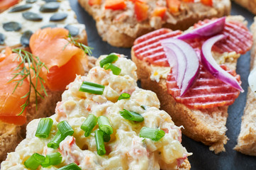 Mix of sandwiches on a stone board