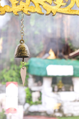 Bell ancient on the way of the Golden mount temple, in Bangkok, Thailand. Selective focus on the bell.
