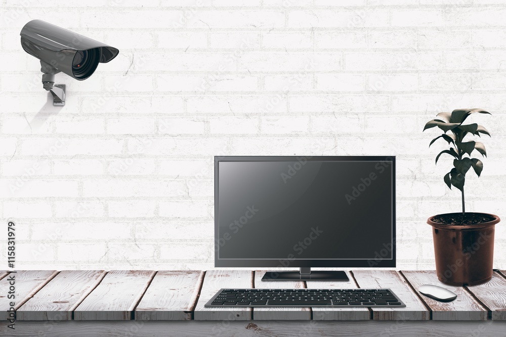 Poster composite image of a computer over a desk