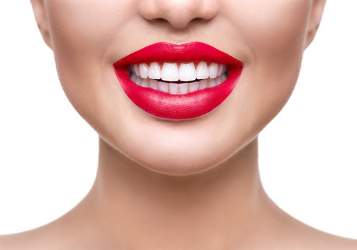 Teeth whitening. Healthy white smile closeup. Beautiful girl with red lips isolated on white