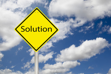 solution on yellow sign