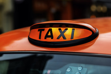 Fototapeta premium illuminated taxi sign of a London taxi