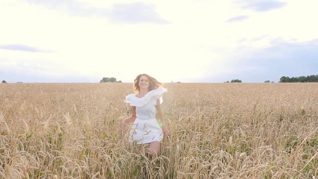 beautiful woman run away in wheat field