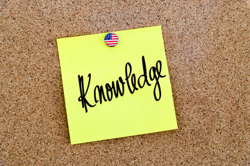 Written text Knowledge over yellow paper note