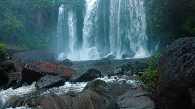 Veil of White Water Tumbles over the Brink of a Natural Park at Phnom Kulen in Cambodia, with Sound. UltraHD video