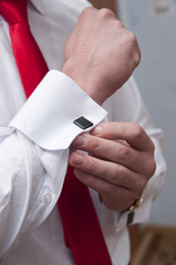 A man is dressing up