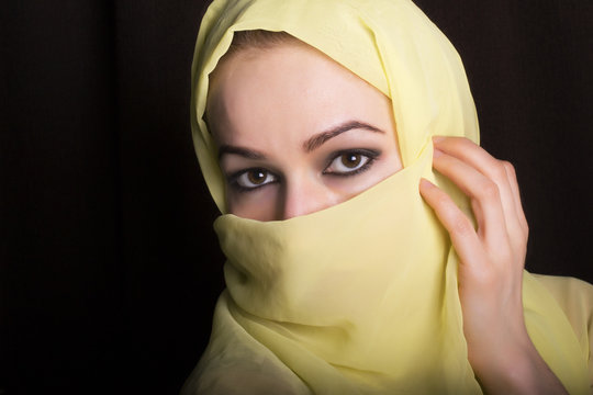 close-up beautiful mysterious eyes eastern woman wearing a hijab