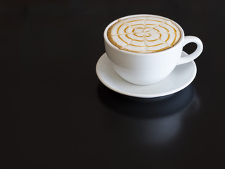 Coffee cup  on wooden table on back background

