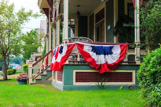 American flag decor on victorian porch