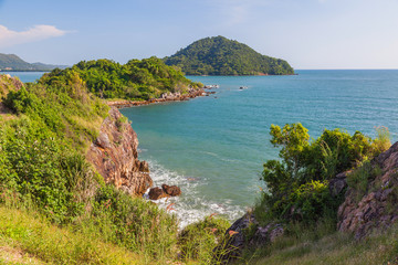 Mountain coast in deep blue sea with blue sky