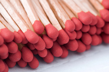 Close-up of red matches on white background