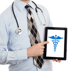 Doctor holding tablet - Caduceus symbol