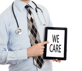 Doctor holding tablet - We care