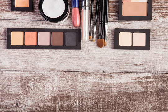 Cosmetics and make up elements on table