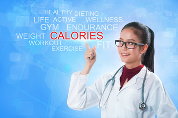 Doctor hand touching calories word on screen with blue background. medical concept