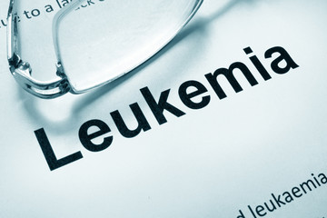 Paper with word leukemia and glasses. Medical concept.