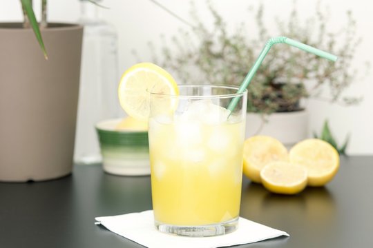 Orangeade with lemon and ice for refresh in summer