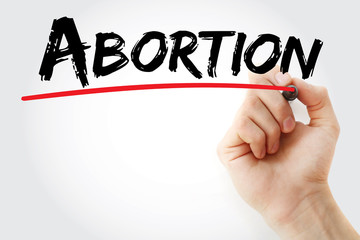 Hand writing Abortion with marker, concept background