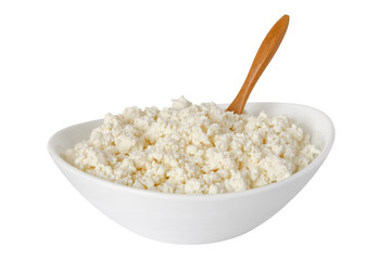 cottage cheese with the wooden spoon in a white bowl isolated on a white background - with clipping path - 115854399