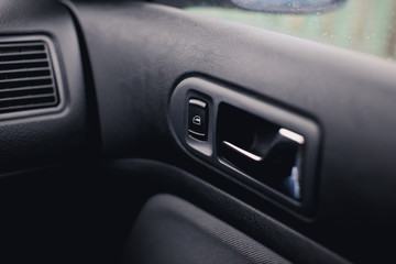 Obraz na płótnie Canvas Handle door opening in the vehicle. Window button.