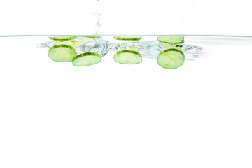 Sliced cucumber splashing water. Healthy and tasty food