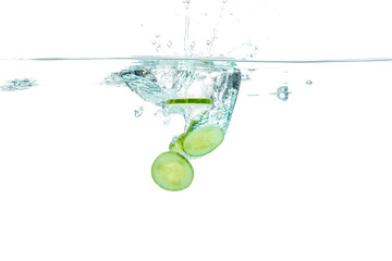 Sliced cucumber splashing water. Healthy and tasty food