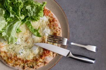 Cheese pizza with salad