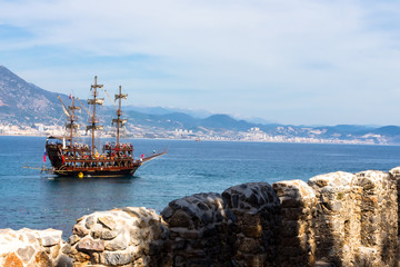 ship floating on the sea on a background of mountains