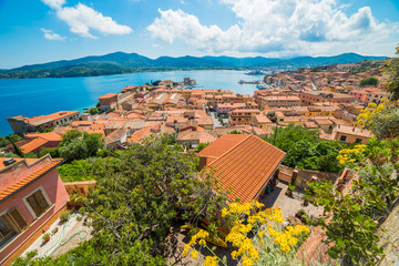 Beautiful aerial view over Porto Azzurro harbor at sunset, in Elba island, Italy