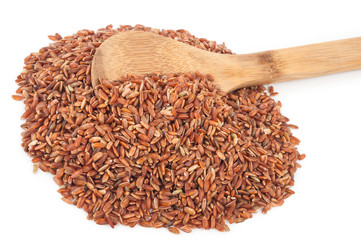 Red rice in a wooden spoon