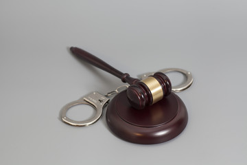 judge's gavel  and handcuffs