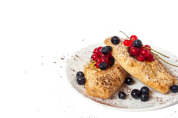 Bake isolated. Scones with jam on a plate. Pastry sprinkled with chocolate. Red currant.