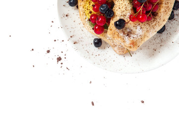 Bake isolated. Scones with jam on a plate. Pastry sprinkled with chocolate. Red currant.