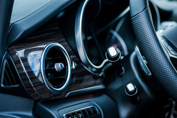 Luxury car interior details. Air deflector and controls