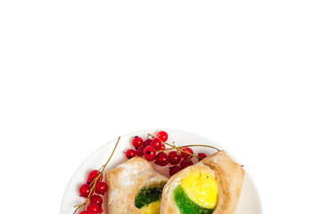 Bake isolated. Scones with jam on a plate. Pastry sprinkled with chocolate. Red currant.