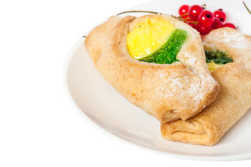 Bake isolated. Scones with jam on a plate. Pastry sprinkled with chocolate. Red currant.