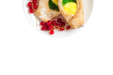 Bake isolated. Scones with jam on a plate. Pastry sprinkled with chocolate. Red currant.